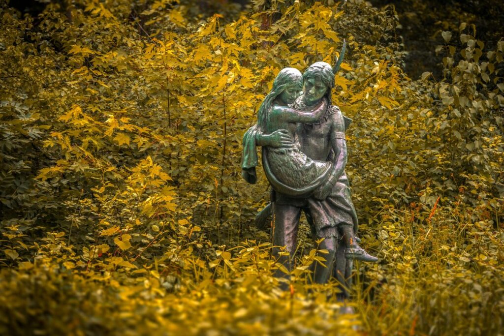 Native american sculpture in autumn foliage