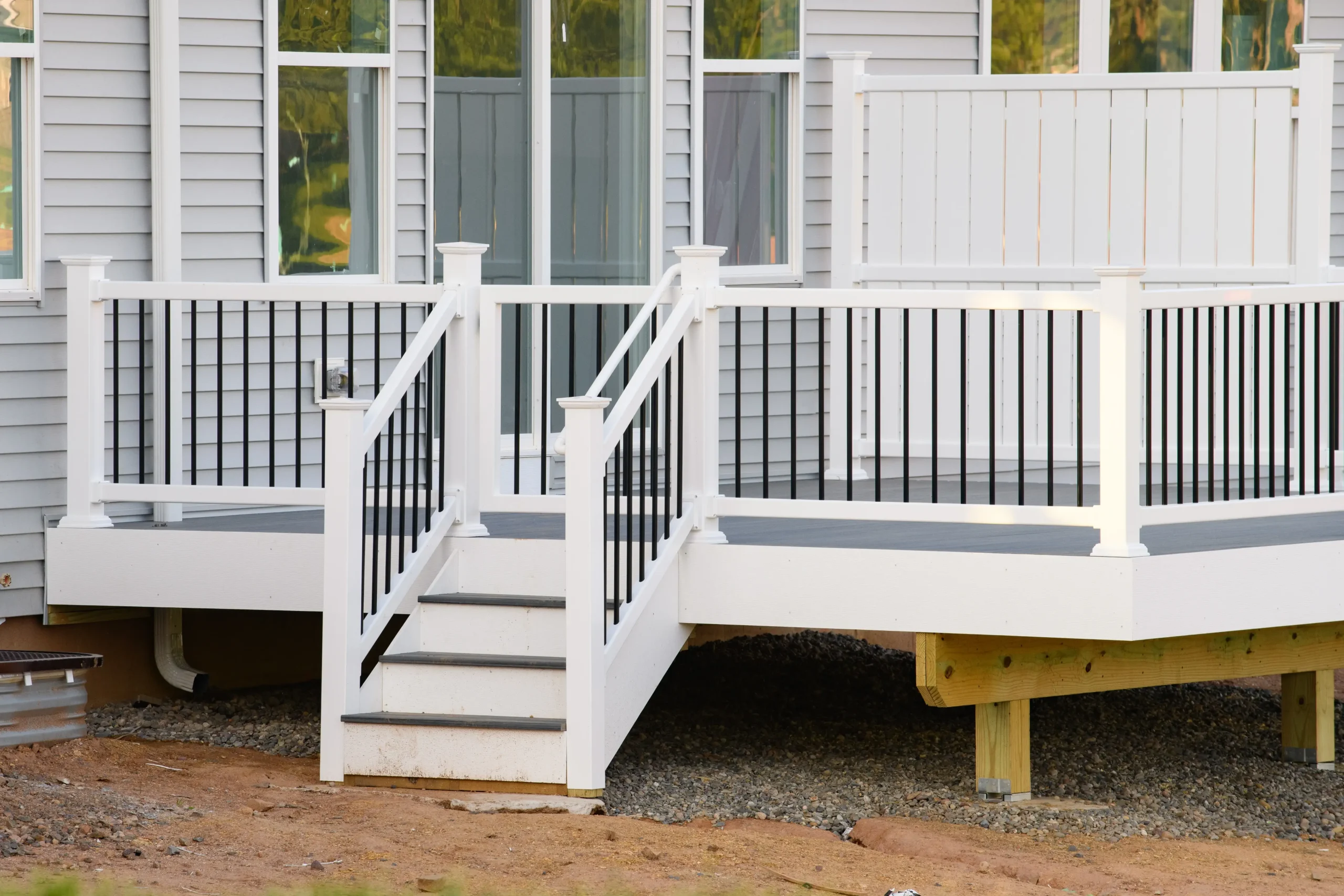 deck-builder-st-paul-mn-new-white-railing-deck-with-stairs-on-home