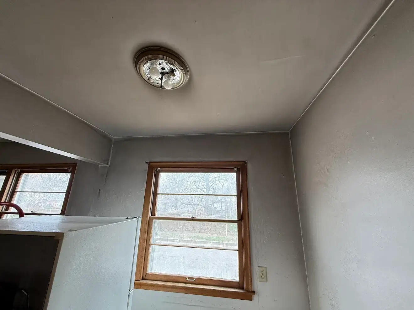 fire-damage-repair-in-st-paul-mn-stained-ceiling-and-walls-near-window