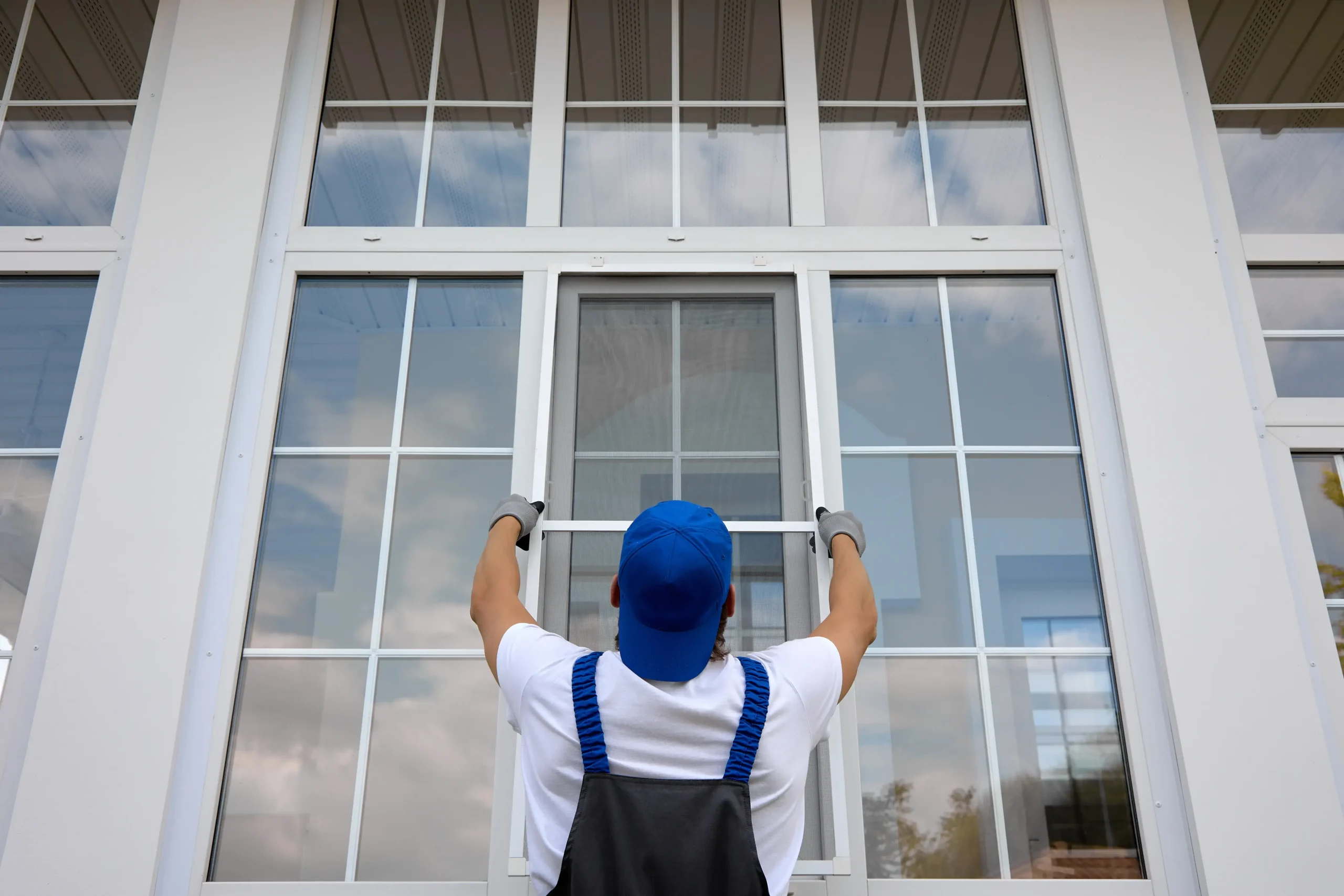 window-installation-in-st-paul-mn-technician-installing-large-residential-window